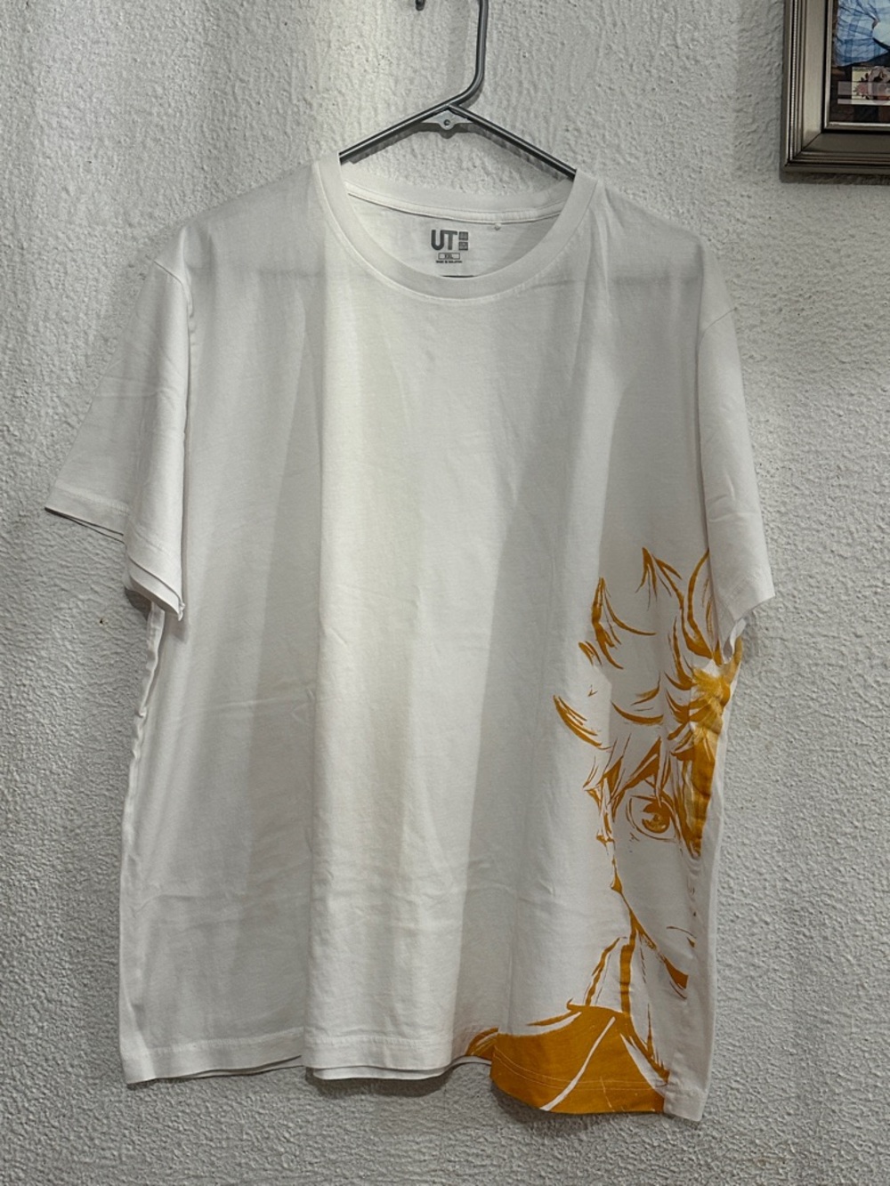 Uniqlo White Short-Sleeve Tee with Yellow Anime Graphic